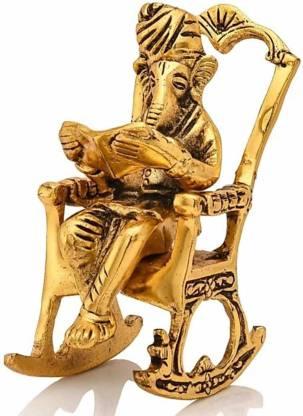 Golden Ganesha idol with the Ramayan, ideal for placement in pooja rooms or offices as a decorative and spiritual piece.