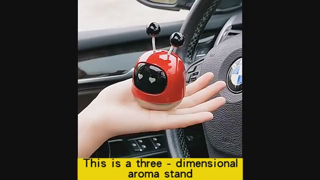 Side angle showing the robot car perfume's unique shaking head feature that activates with car motion.